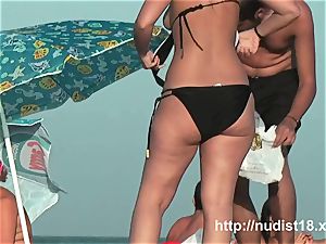 nude beach voyeur flick of warm playful nudists in water